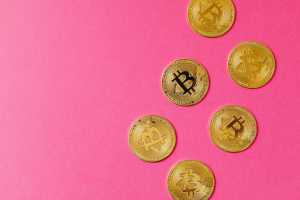 Gold Round Coins on Pink Surface