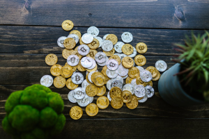 Silver and Gold Round Coins on a Wooden Surface