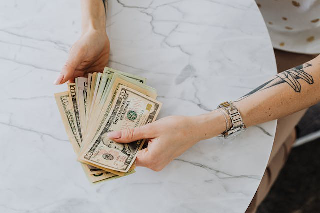 An investor counting dollar bills