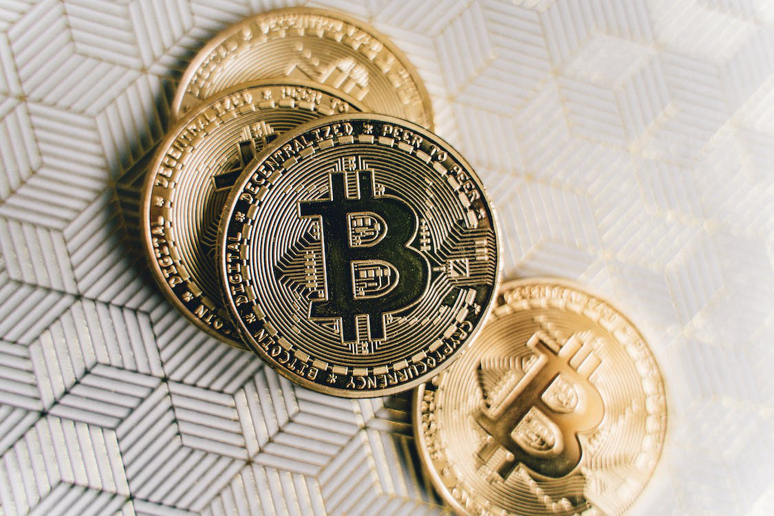 Close-Up Photo of Four Bitcoins