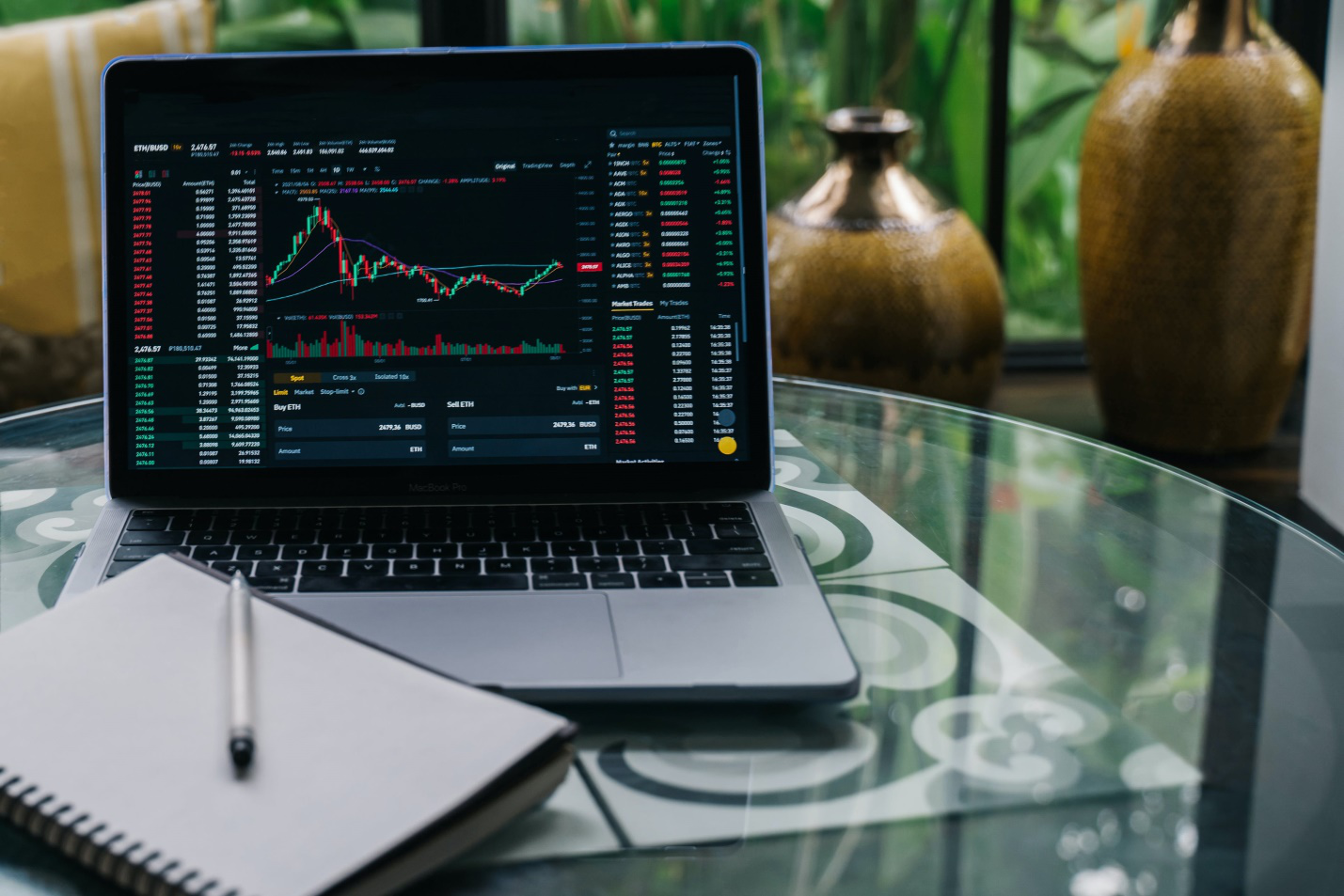 a crypto trading data chart displayed on laptop screen with book 