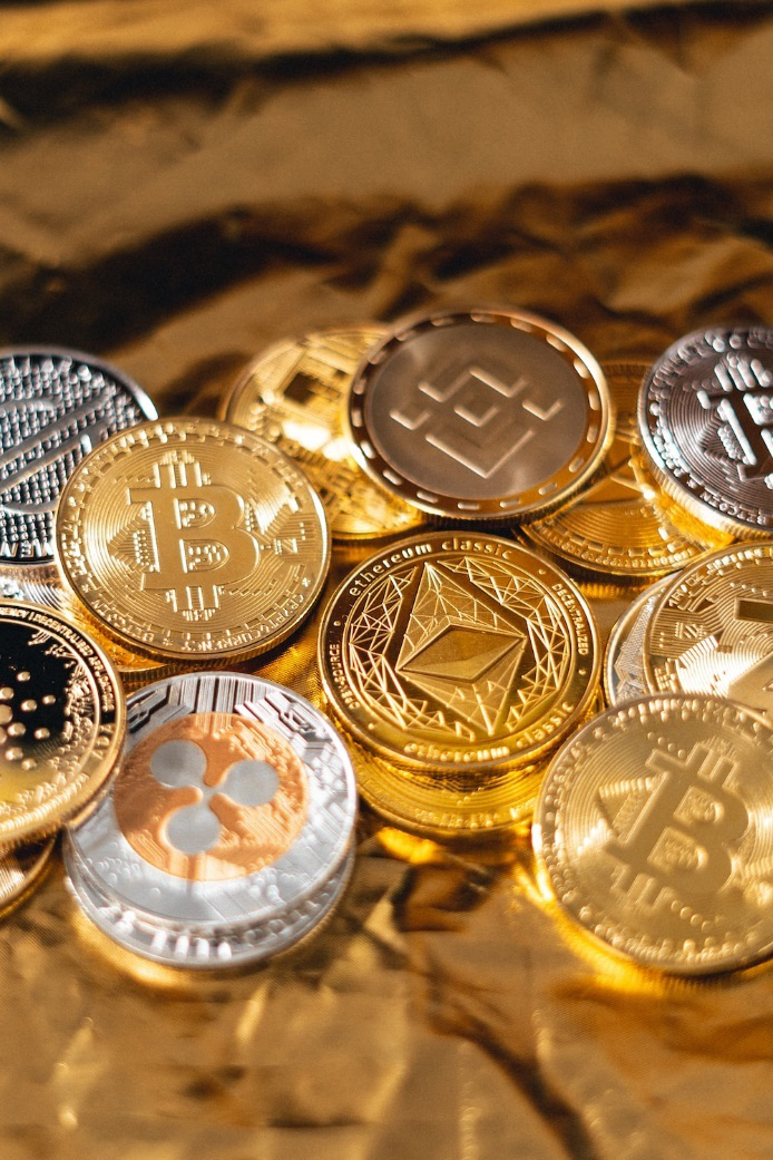 Several cryptocurrency coins depicting cryptocurrency investments