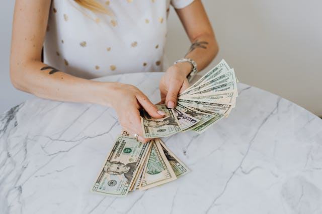 An investor counting dollar bills