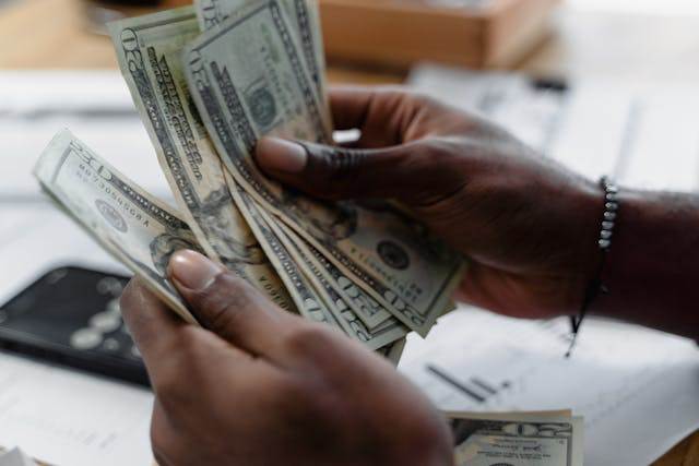 An investor counting dollar bills