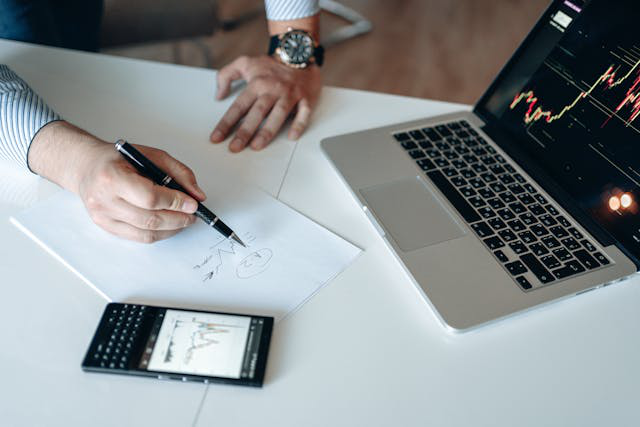 An individual analyzing a Bitcoin graph