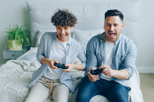 two people indulged in console gaming