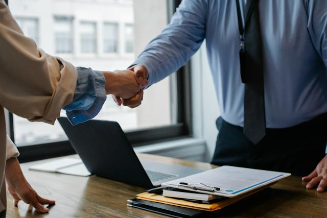 An investor shaking hands with an investment consultant