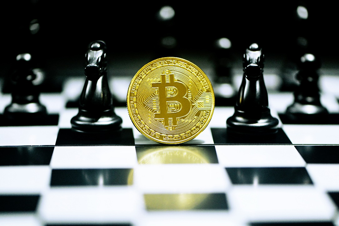 A Bitcoin on a chess board.