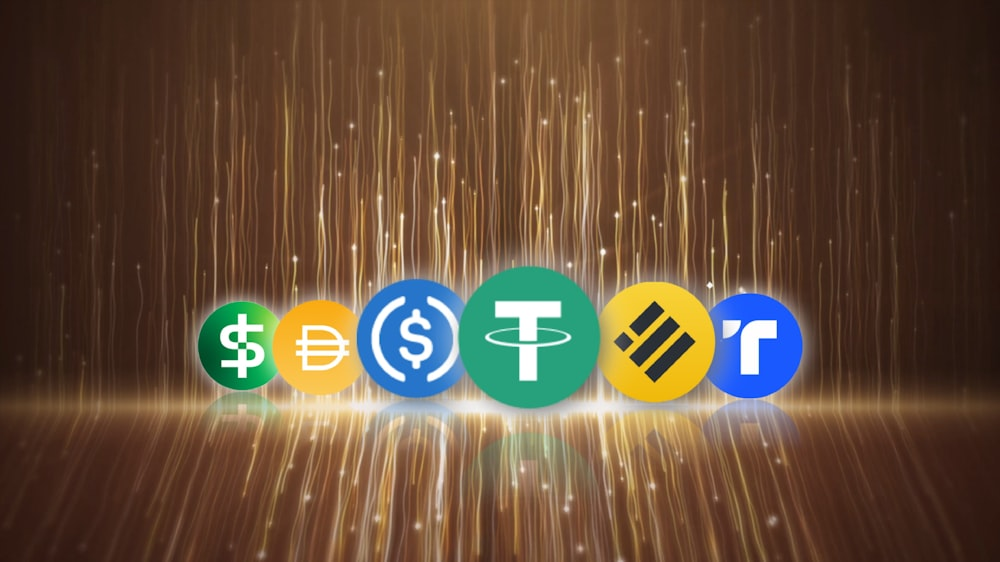  Icons of various stablecoins displayed on a glowing background.