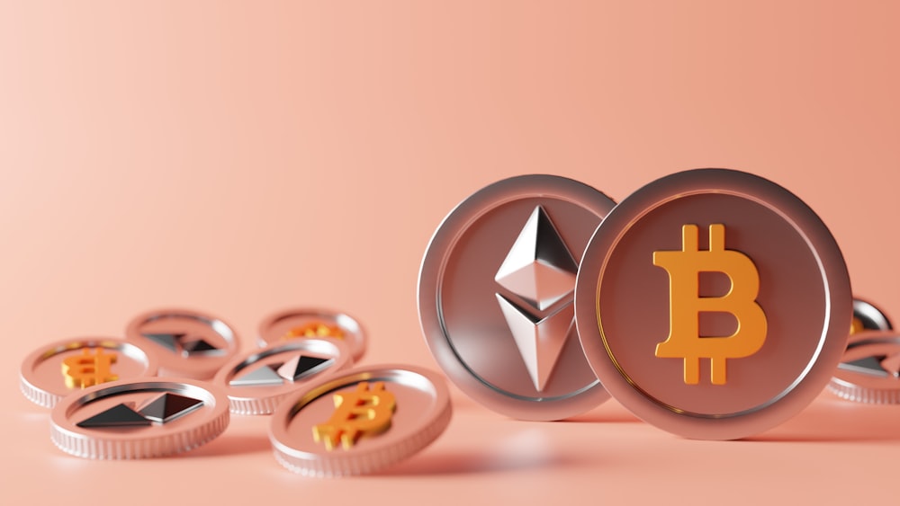 Multiple coins with Bitcoin and Ethereum logos on a peach background