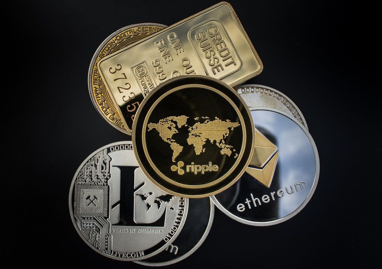 A collection of various digital currencies, including Ripple, Ethereum, Litecoin, and gold.