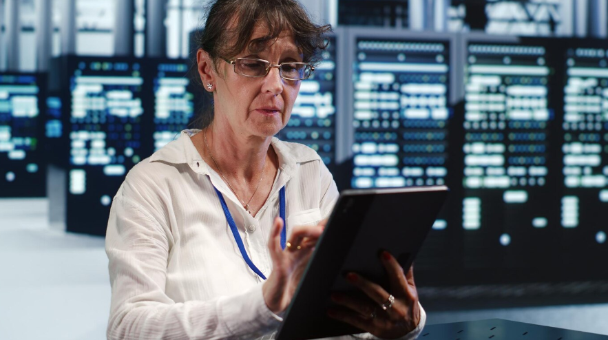 a woman in a high-tech space surrounded by AI servers