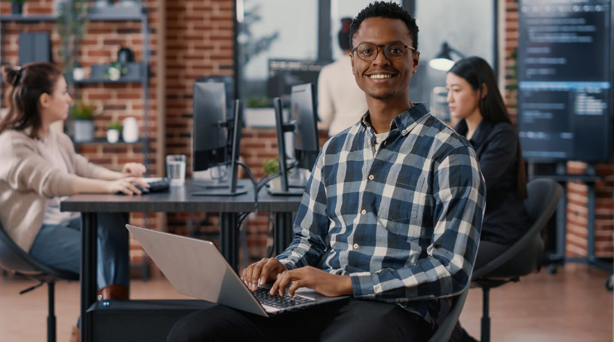 an app developer using a laptop