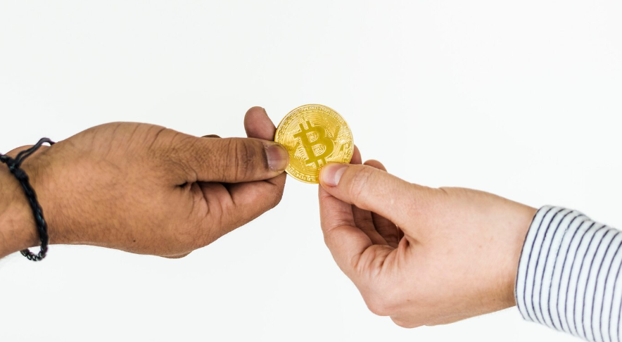 men exchanging Bitcoin