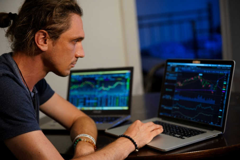 A laptop screen showing a cryptocurrency price chart