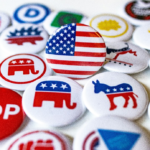 A collection of political party buttons.