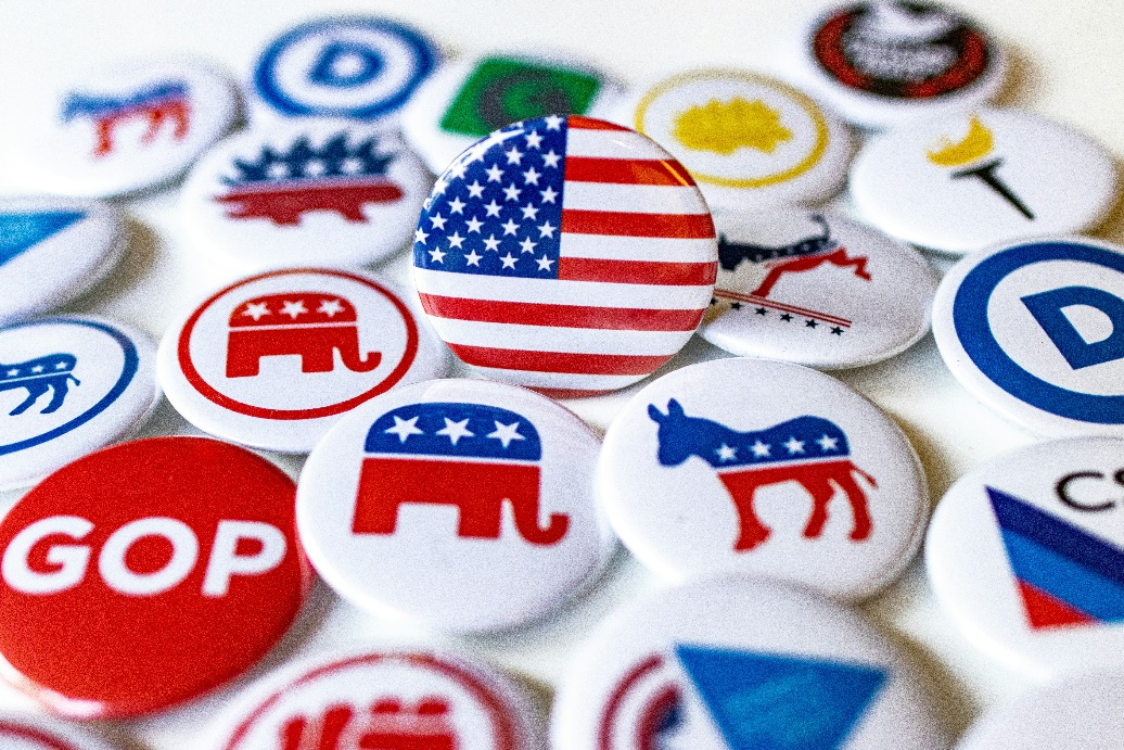 A collection of political party buttons.