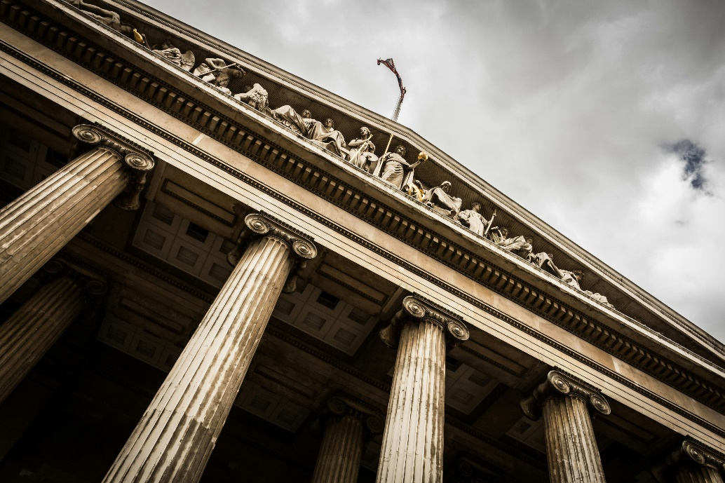 kenson Investments | Regulatory Clarity as a Catalyst: The Role of FIT21 in Shaping the U.S. Digital Asset Landscape Low-angle view of a government-style building.