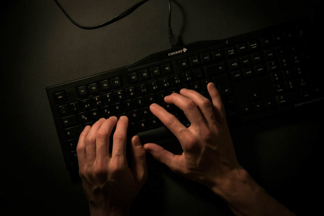 kenson Investments | The Security Risks of Tokenized Assets – How to Mitigate Vulnerabilities Person typing on a black keyboard