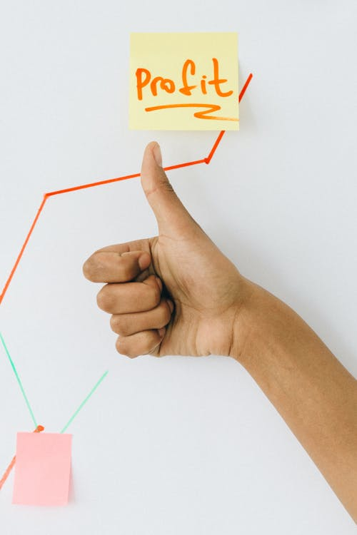 kenson Investments | Supporting Market Awareness – How Kenson Investments Helps Navigate Regulatory Shifts person holding orange and white paper