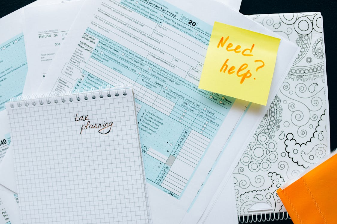 kenson Investments | Yield Strategy Education: Exploring Digital Asset Income in a Rising Rate Environment tax documents on the table