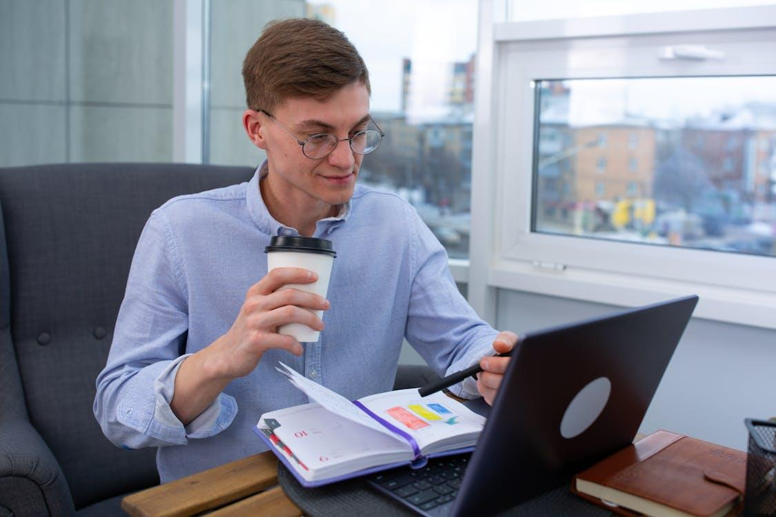 kenson Investments | Smart Contract Audit Evolution – The Role of AI and Human Oversight businessman man person coffee