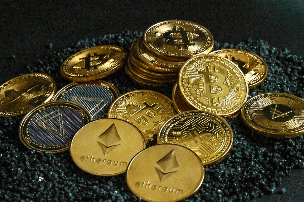 kenson Investments | Institutional Crypto Allocations Surge 87% in 2025: A New Era of Digital Asset Adoption A pile of bitcoins resting on gravel.