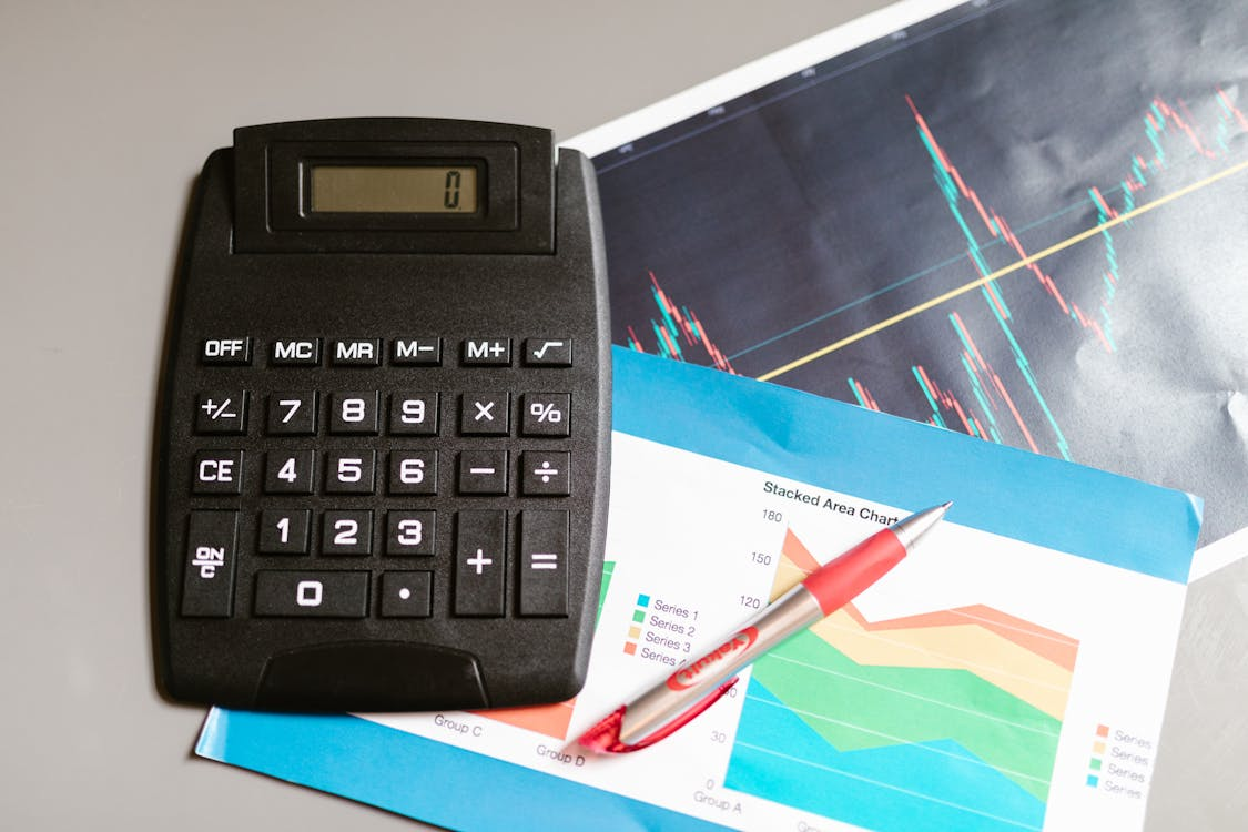 kenson Investments | Toward Standardized Reporting – Digital Asset Accounting Across Jurisdictions black calculator on the table