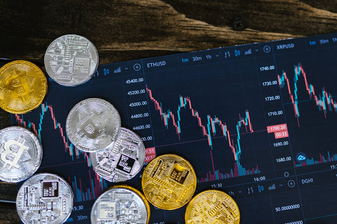 kenson Investments | Toward Standardized Reporting – Digital Asset Accounting Across Jurisdictions close up shot of silver and gold round coins