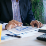 Professional holding a tablet reviewing digital asset regulations and stablecoin policies.