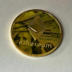 Close-up of a gold-colored Ethereum ornament.