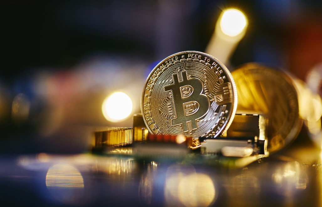 kenson Investments | Bitcoin’s Upward Move Continues as Trading Week Winds Down Bitcoin on a computer chip.