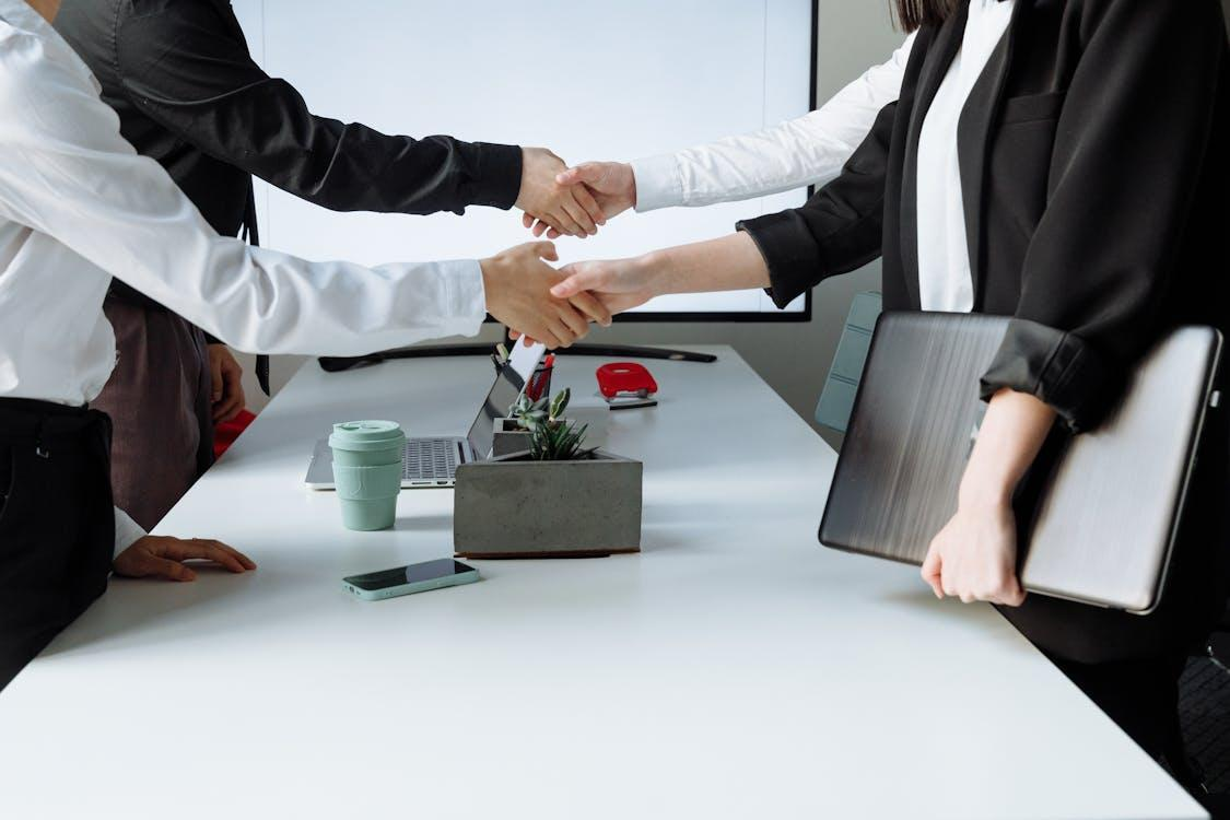photo of people shaking hands