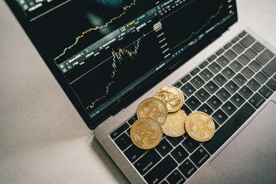 Cryptocurrency coins placed on a laptop.