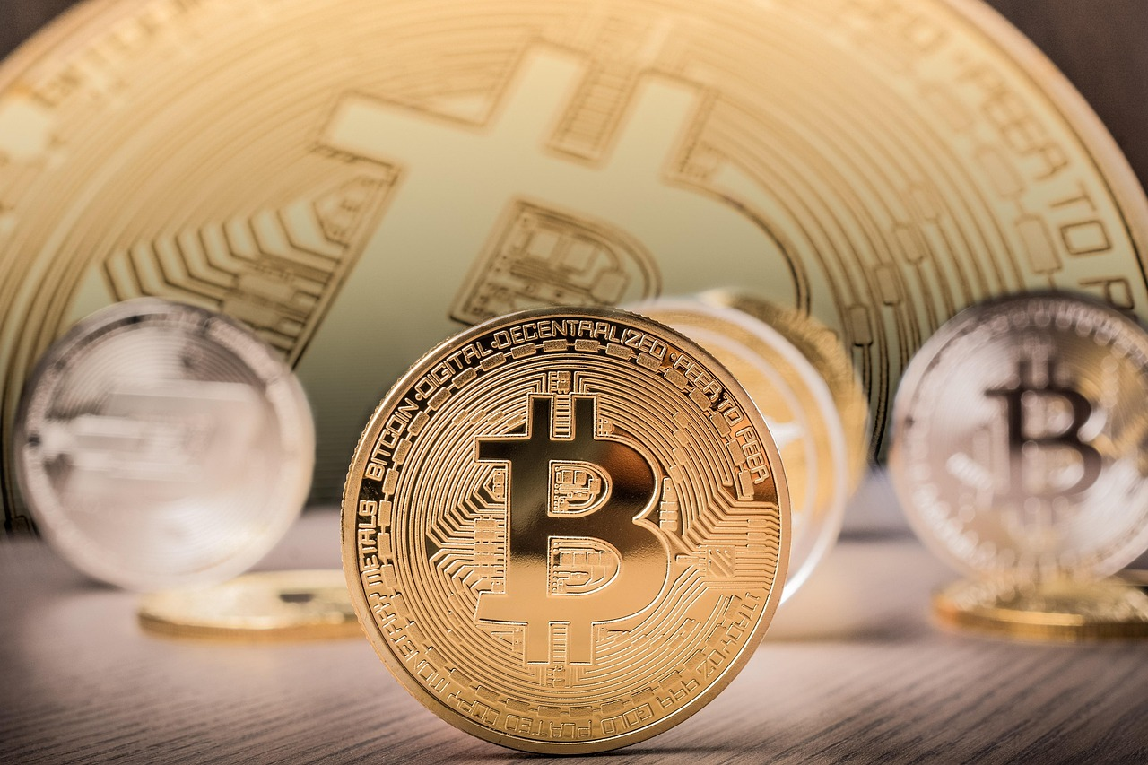 Gold and silver cryptocurrency coins representing Bitcoin and presale token launches.