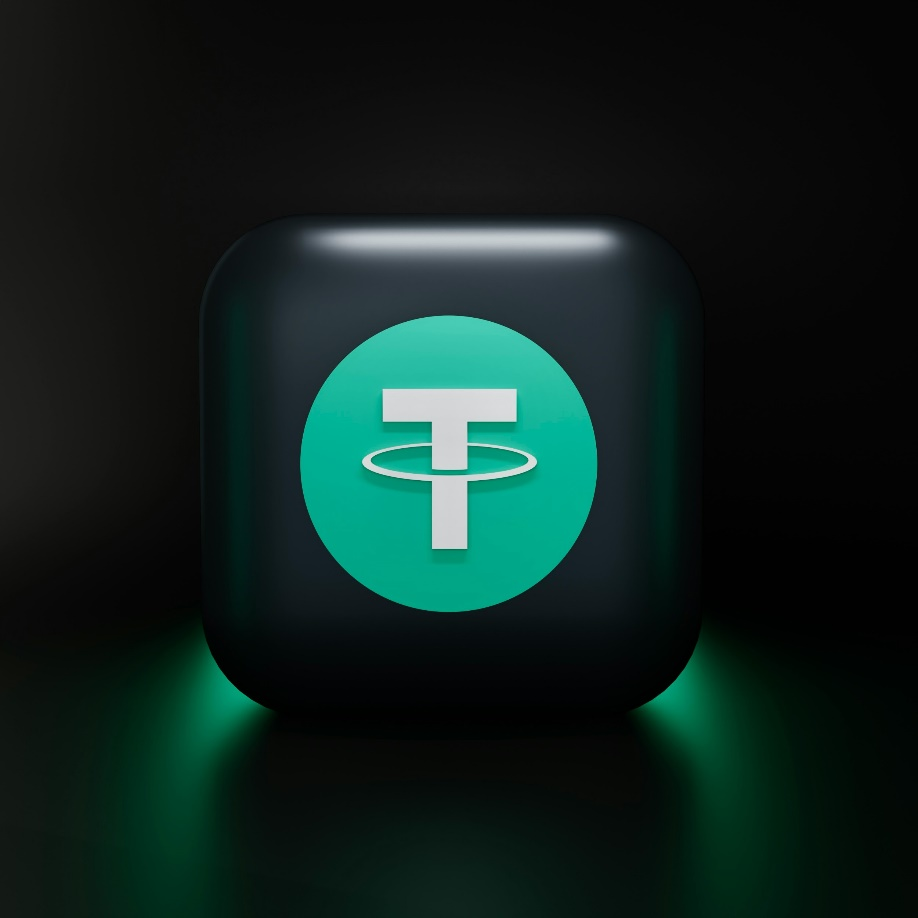 3D-rendered Tether logo illuminated against a dark background