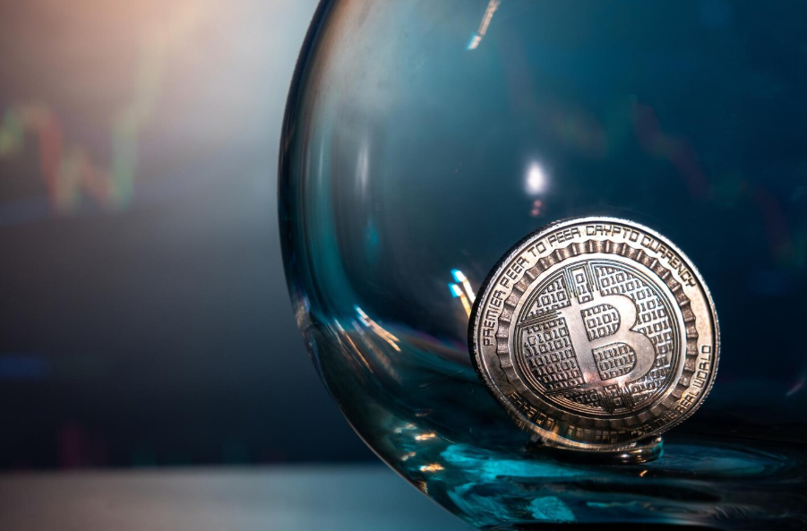 Silver Bitcoin resting on a blue reflective glass surface representing digital asset liquidity visibility