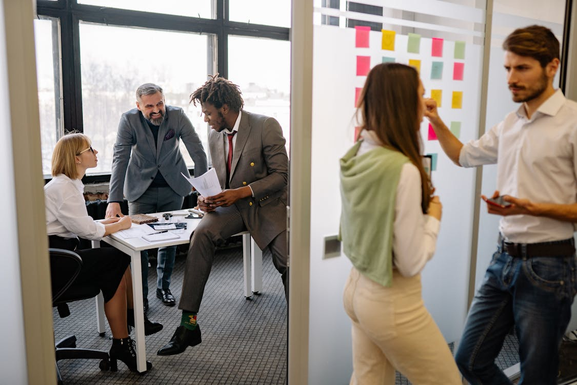 Teams from different departments aligning strategies in a corporate setting