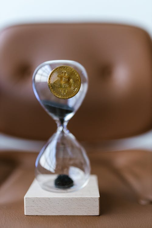 A bitcoin on an hourglass.