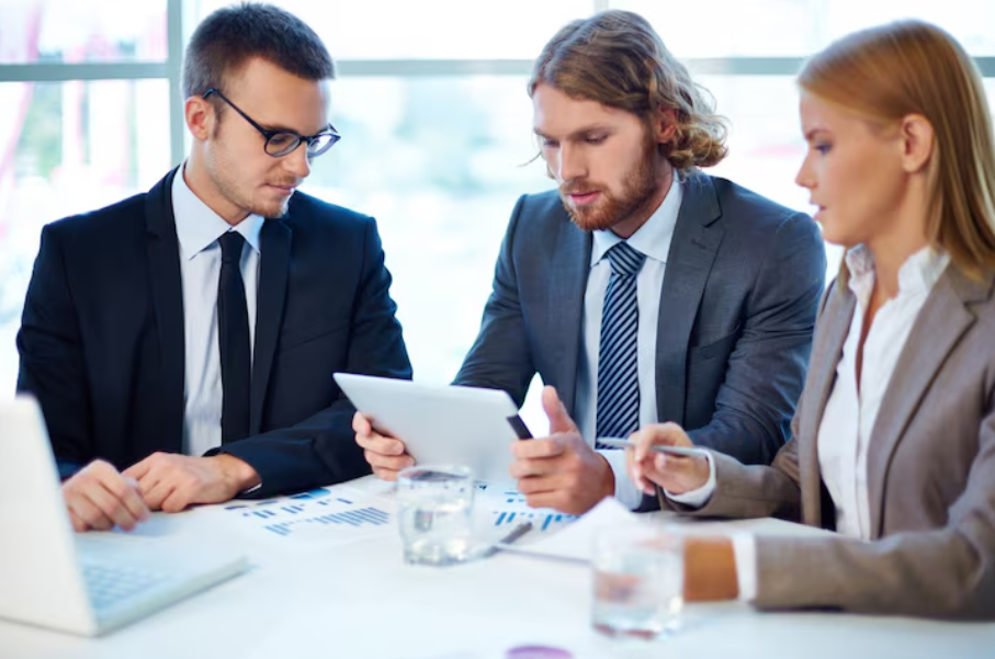 Group of professionals discussing digital asset education and blockchain market mechanics in a meeting
