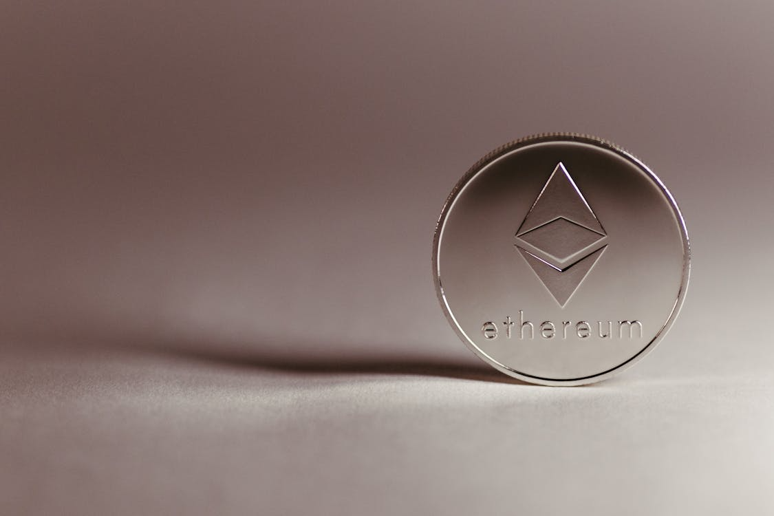 Close-up of a physical Ethereum cryptocurrency coin.