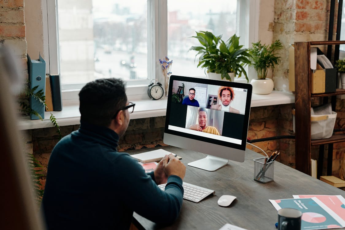 A distributed team collaborating across time zones using digital communication tools