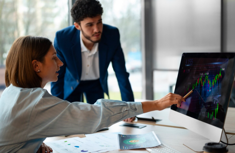 kenson Investments | Why Execution Strategy Is Becoming a Competitive Edge in Digital Assets Consultants reviewing trade execution performance across institutional digital asset systems