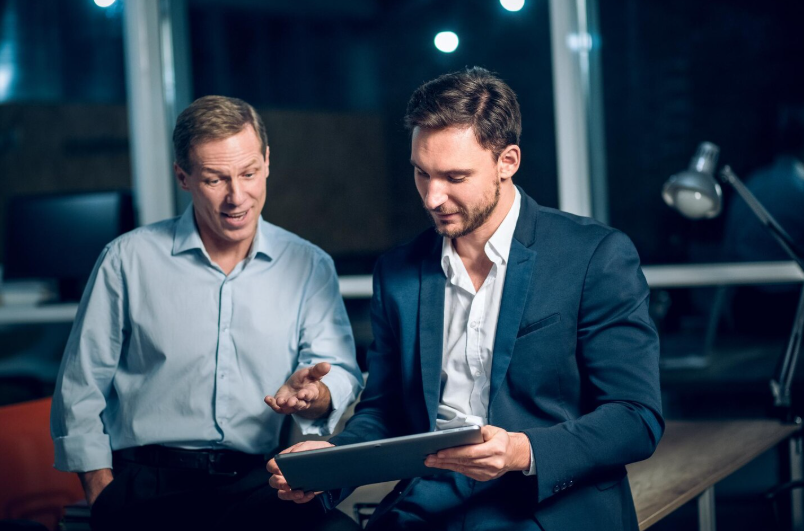 Digital asset management consultants reviewing automated trading risk and execution control systems