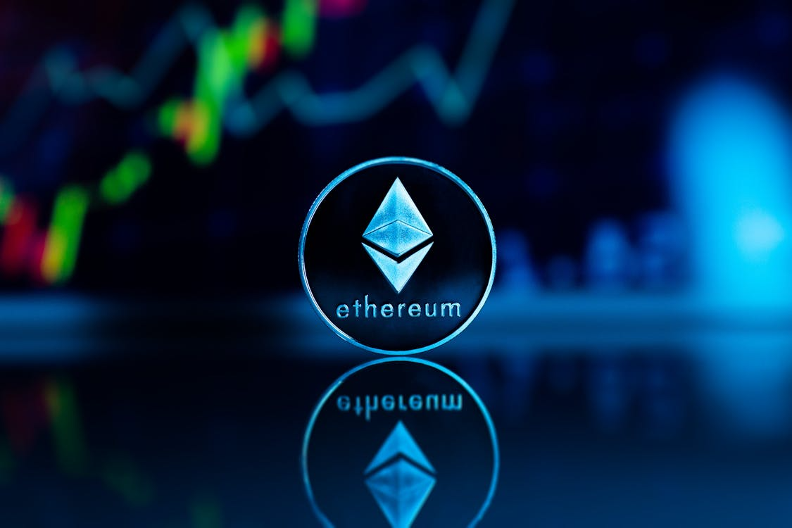 kenson Investments | Sharplink Allocates $100M in ETH Holdings Toward Structured Onchain Strategies Ethereum symbol against blue background representing institutional blockchain treasury strategies.