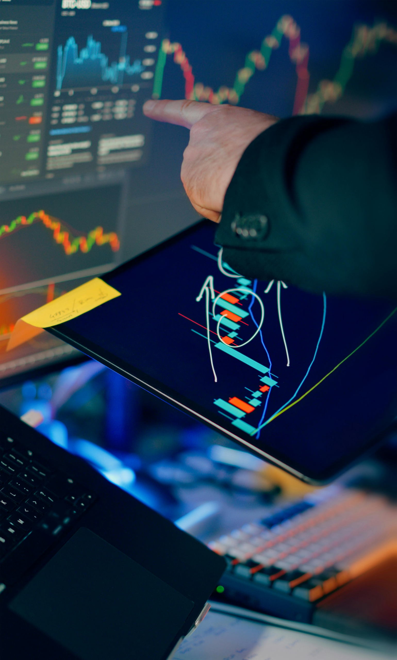 kenson Investments | Why Capital Deployment Depends on Data Confidence Financial analyst reviewing digital asset market data and trading patterns across multiple screens during institutional market analysis