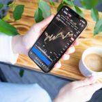 kenson Investments | Why Execution Certainty Is Replacing Speed as a Priority Investor reviewing digital asset trading activity and live execution data on a mobile trading interface during active market conditions.