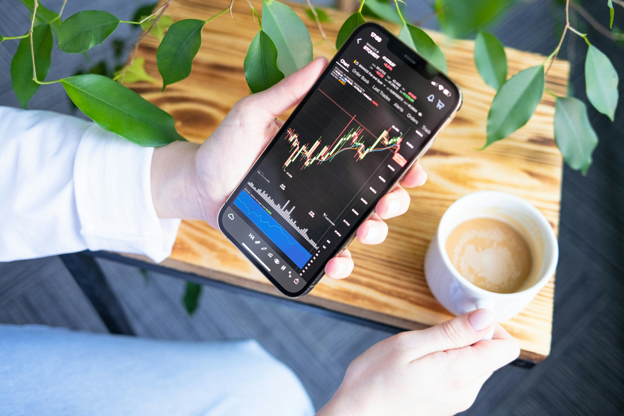 kenson Investments | Why Execution Certainty Is Replacing Speed as a Priority Investor reviewing digital asset trading activity and live execution data on a mobile trading interface during active market conditions.