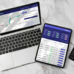 kenson Investments | When Data Fragmentation Obscures Market Reality Laptop, tablet, and smartphone displaying digital asset trading dashboards, market analytics, and portfolio monitoring interfaces