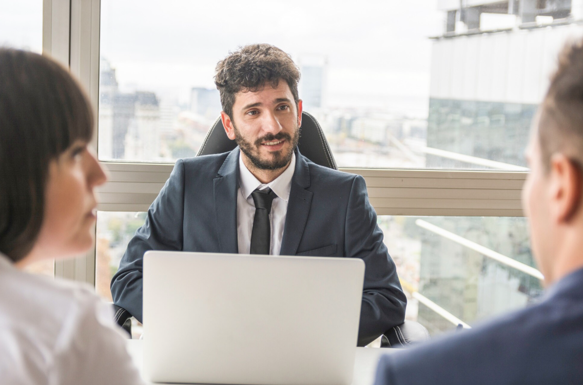 kenson Investments | Bitcoin Reclaims $80K as Markets Stabilize Following Inflation Data Two investors speaking with a digital asset consultant.